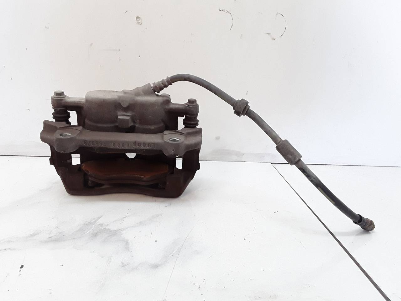 Pinza de freno delantera derecha
